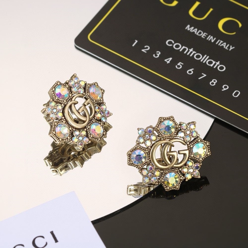 G*u*i earrings